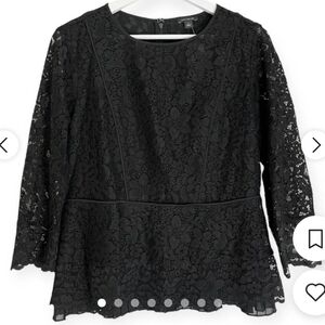 Ann Taylor black lace overlay peplum style blouse. Sheer fan hem. Medium